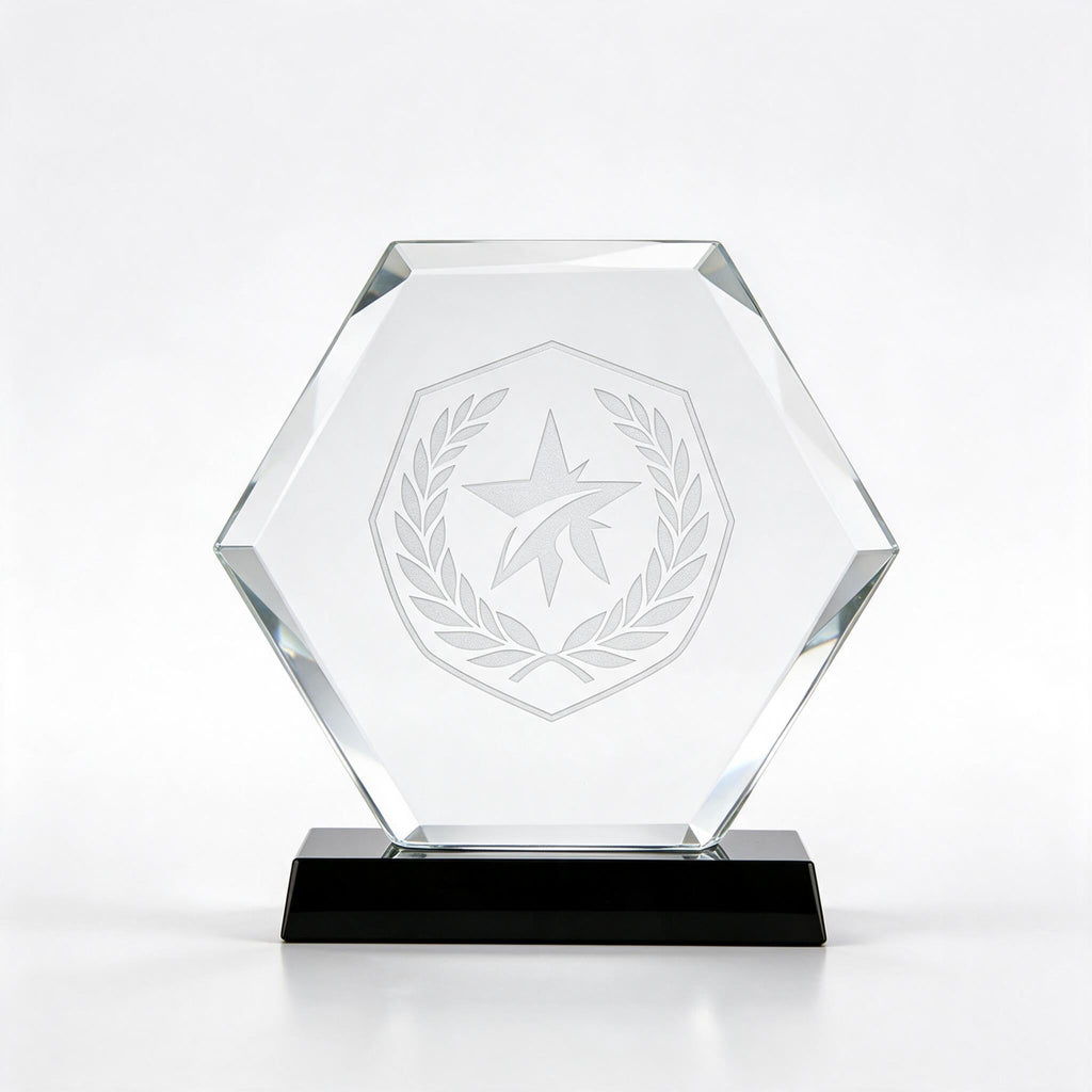 Clear crystal hexagon award with laser-engraved crest, on a black crystal base